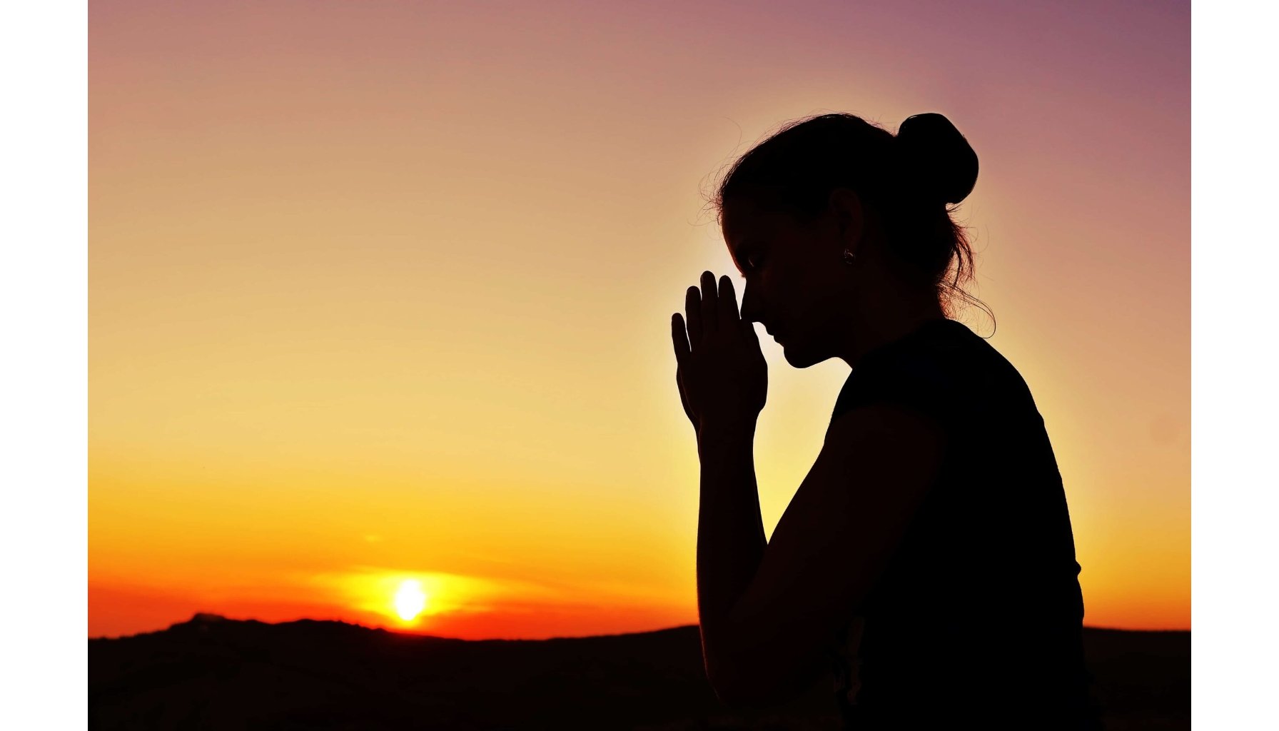 The Serenity Prayer - woman praying at sunset